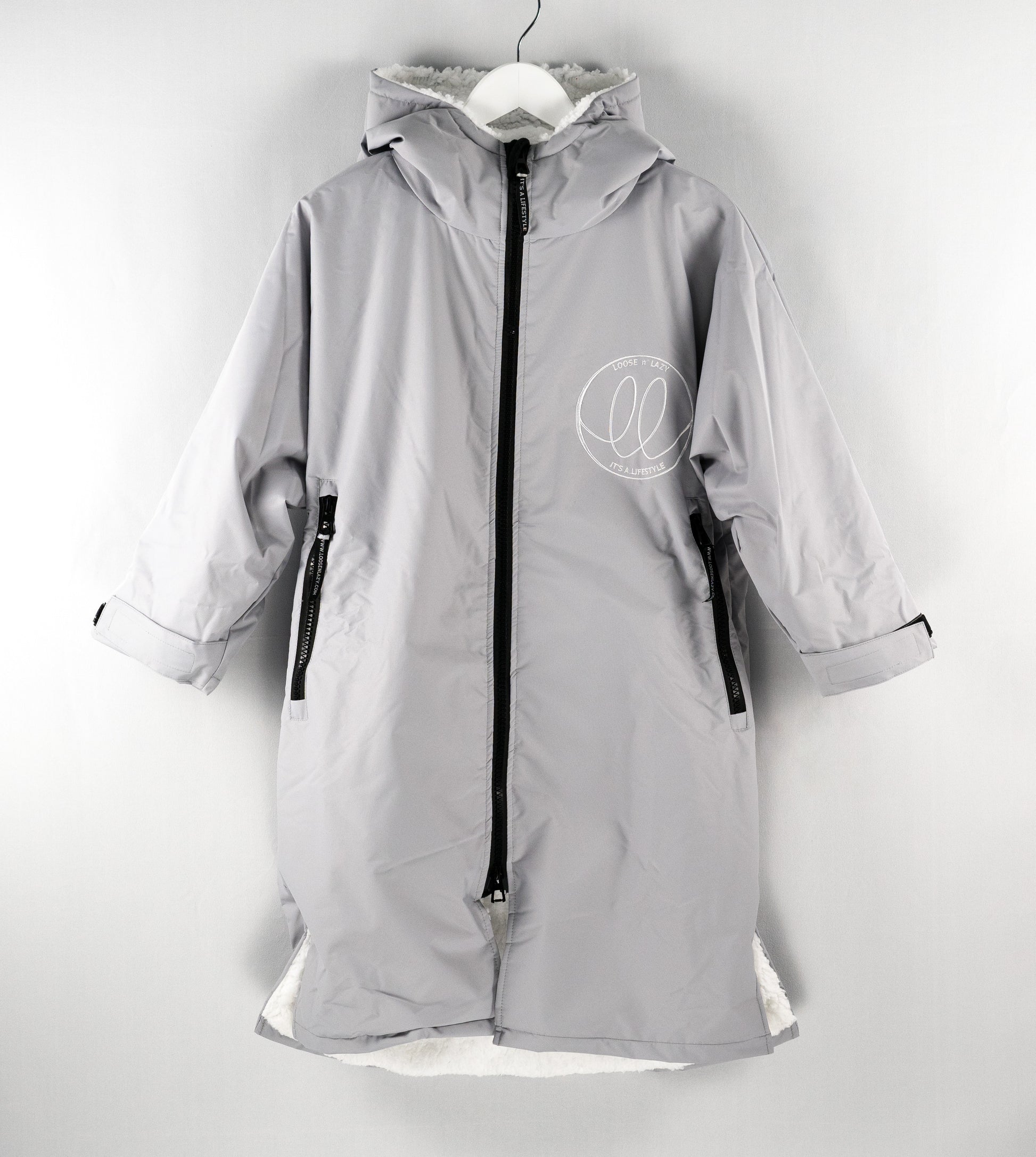 Grey swimming changing robe with white fluffy inner lining.